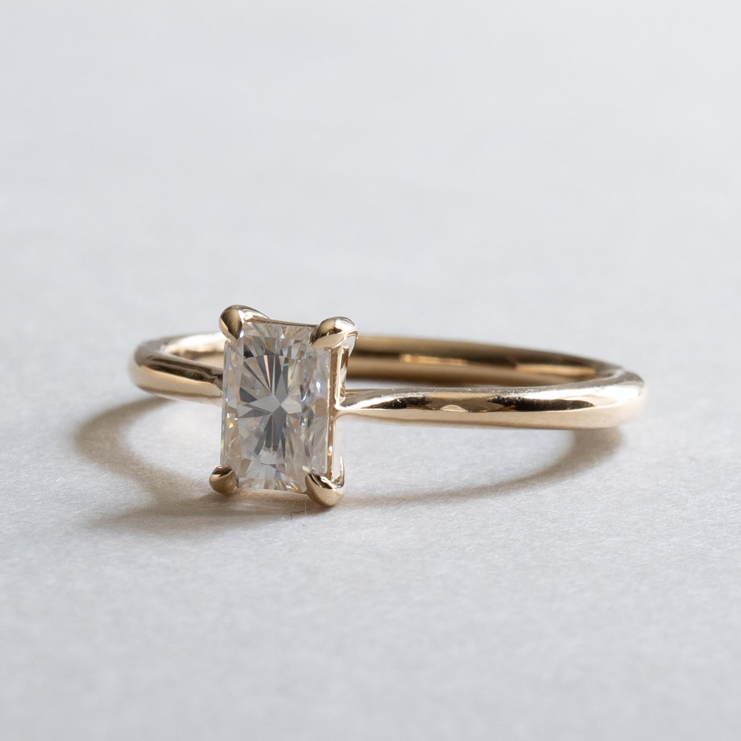 Forever One Moissanite Ring: 14K Yellow Gold Radiant Emerald Cut Solitaire