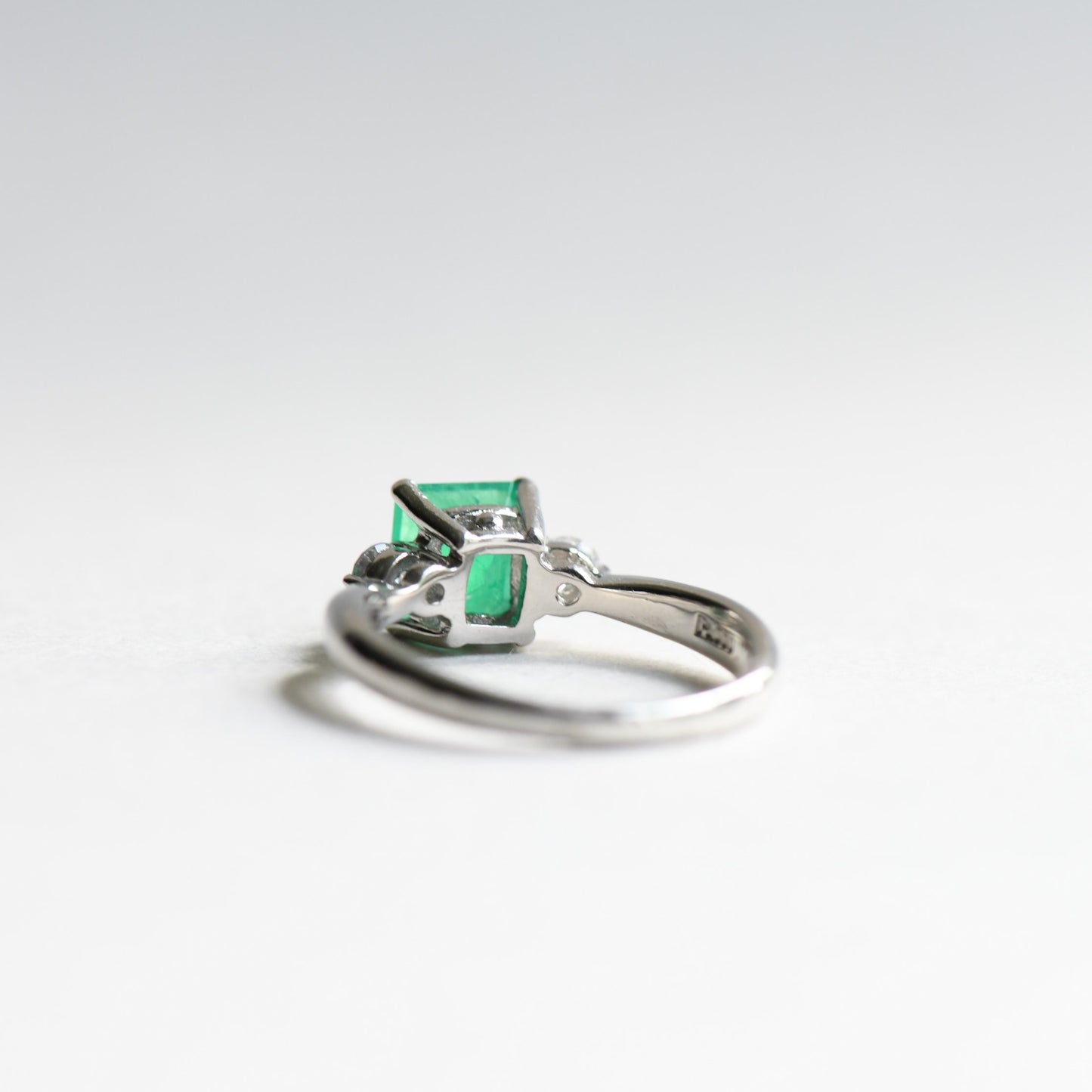 Platinum Emerald Diamond Ring: 1.23 Carat Three Stone Estate Ring